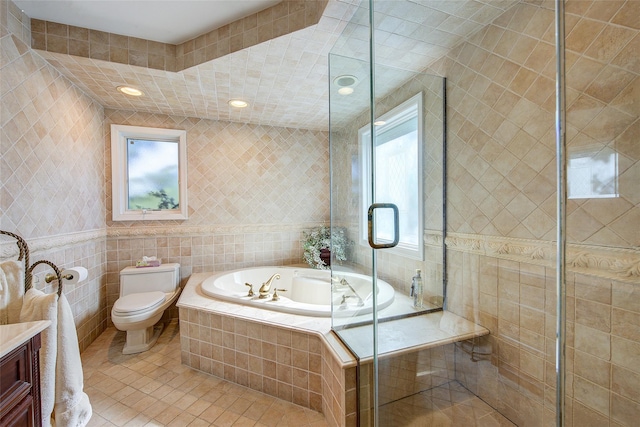 7015 170th St, Fresh Meadows, NY 11365 - full bath with tile walls, a bath, tile patterned flooring, vanity, and a tile shower