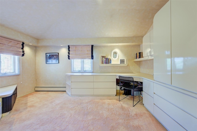 7015 170th St, Fresh Meadows, NY 11365 - bedroom with baseboard heating, light colored carpet, and built in desk