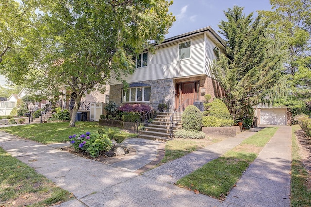 7015 170th St, Fresh Meadows, NY 11365 - view of front of home with stone siding and a front yard