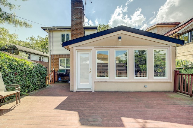 7015 170th St, Fresh Meadows, NY 11365 - rear view of property featuring a deck and a chimney