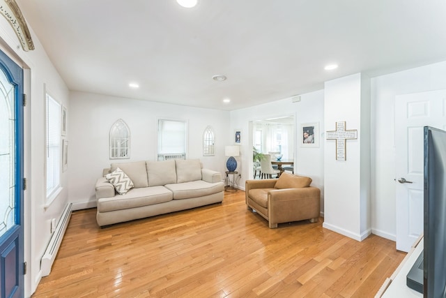 90 Redmond Ave, Bay Shore, NY 11706 - living area featuring a baseboard heating unit, light wood finished floors, and recessed lighting