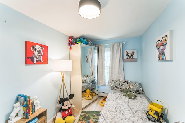 90 Redmond Ave, Bay Shore, NY 11706 - playroom featuring baseboard heating and wood finished floors