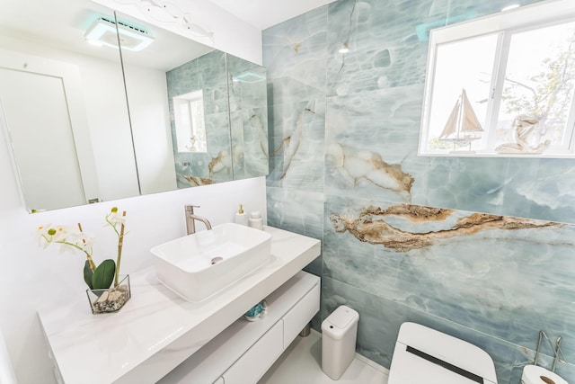 90 Redmond Ave, Bay Shore, NY 11706 - half bath featuring tile walls, plenty of natural light, and vanity