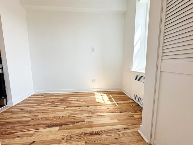 35-24 78th St Unit A67, Jackson Heights, NY 11372 - empty room with radiator and light wood-style floors