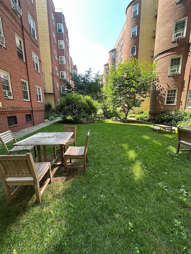 35-24 78th St Unit A67, Jackson Heights, NY 11372 - view of community featuring a yard