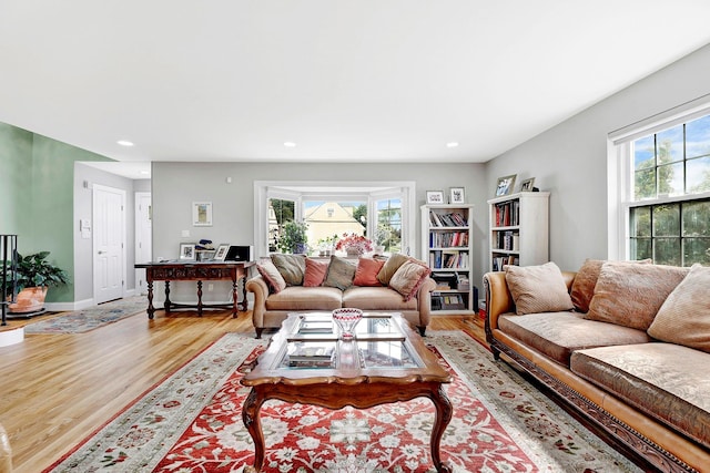 97 Burnham Ave, Roslyn Heights, NY 11577 - living room with light wood finished floors, plenty of natural light, and recessed lighting