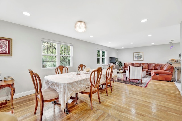 97 Burnham Ave, Roslyn Heights, NY 11577 - dining area with healthy amount of natural light, light wood finished floors, and recessed lighting