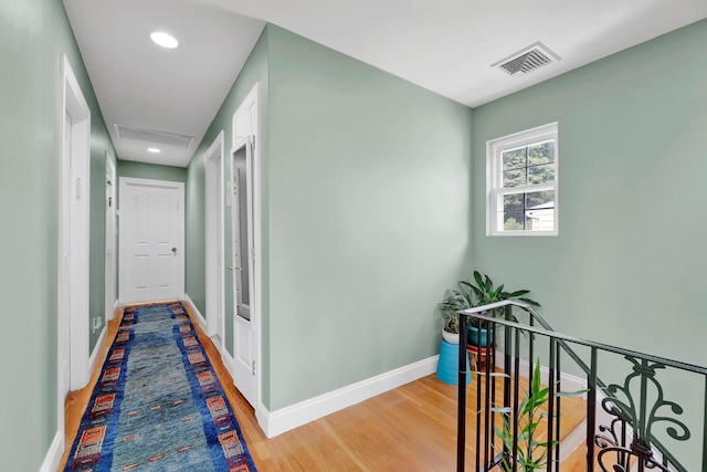 97 Burnham Ave, Roslyn Heights, NY 11577 - corridor featuring an upstairs landing, light wood-style floors, and recessed lighting