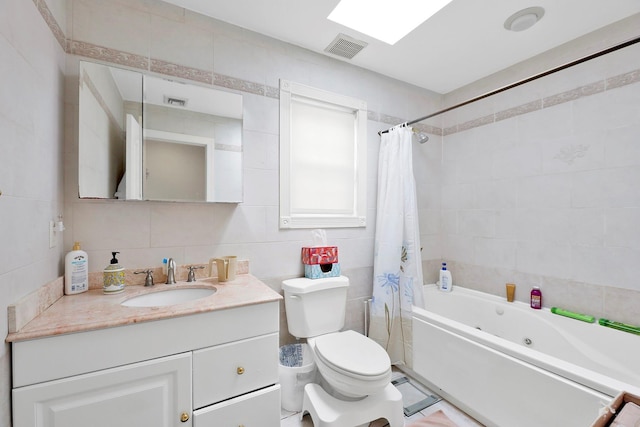 97 Burnham Ave, Roslyn Heights, NY 11577 - full bathroom featuring tile walls, vanity, and a combined bath / shower with jetted tub