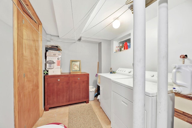 97 Burnham Ave, Roslyn Heights, NY 11577 - laundry area with washer and clothes dryer and light tile patterned flooring