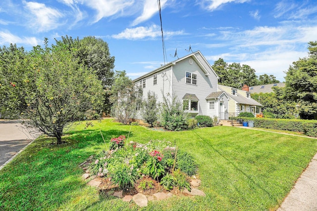97 Burnham Ave, Roslyn Heights, NY 11577 - view of side of property featuring a yard
