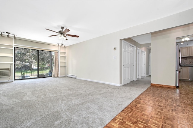 115 Dehaven Dr Unit 214, Yonkers, NY 10703 - unfurnished living room with a ceiling fan, carpet flooring, a baseboard radiator, and an AC wall unit