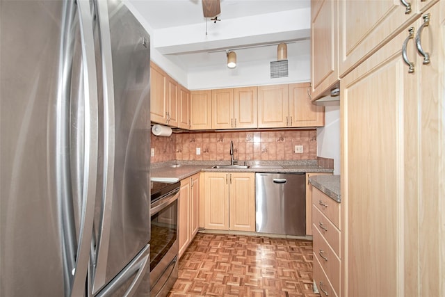 115 Dehaven Dr Unit 214, Yonkers, NY 10703 - kitchen featuring appliances with stainless steel finishes, light brown cabinets, backsplash, and ceiling fan