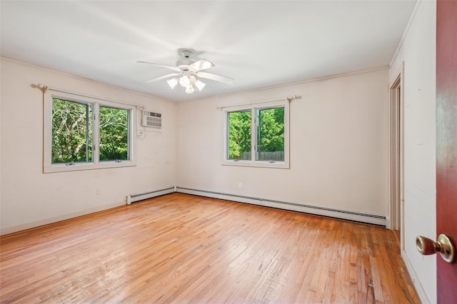 27 Jagger Ln, Westhampton, NY 11977 - spare room with healthy amount of natural light, a baseboard heating unit, wood-type flooring, a wall mounted air conditioner, and ornamental molding