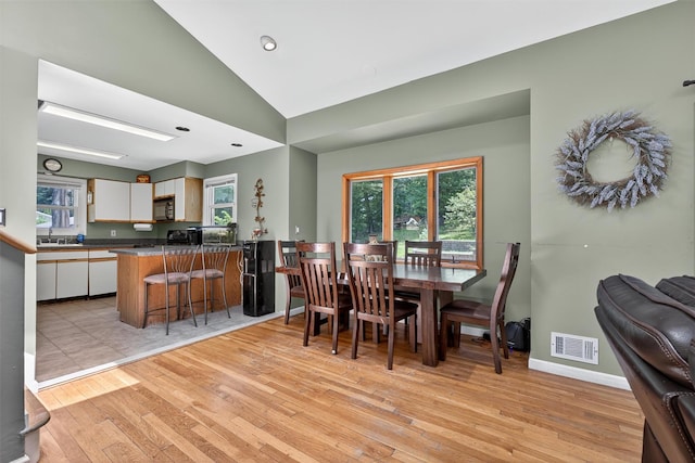 3324 Sycamore Ln, Yorktown Heights, NY 10598 - dining space featuring light wood-style floors, lofted ceiling, and recessed lighting