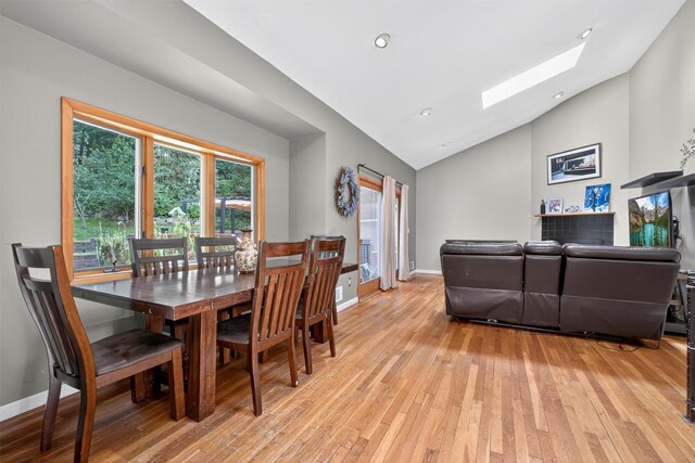 3324 Sycamore Ln, Yorktown Heights, NY 10598 - dining area featuring a skylight, light wood-type flooring, high vaulted ceiling, and recessed lighting