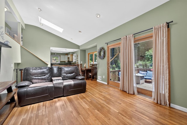 3324 Sycamore Ln, Yorktown Heights, NY 10598 - living room with vaulted ceiling, light wood-style flooring, a skylight, plenty of natural light, and recessed lighting