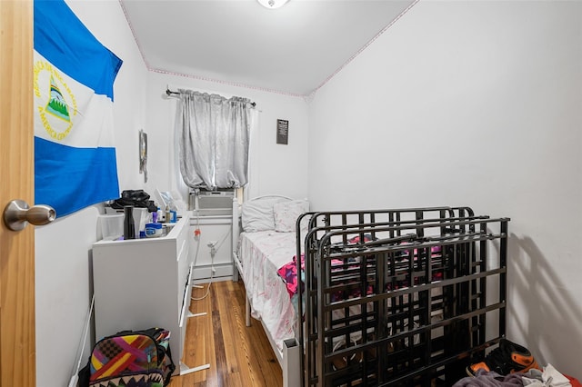74-25 93rd Ave, Woodhaven, NY 11421 - bedroom featuring wood finished floors and cooling unit
