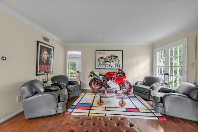26 Rolling Dr, Brookville, NY 11545 - living area with wood finished floors, healthy amount of natural light, and crown molding