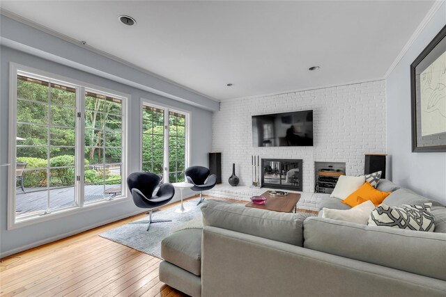 26 Rolling Dr, Brookville, NY 11545 - living area with a brick fireplace and hardwood / wood-style floors