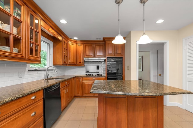 26 Rolling Dr, Brookville, NY 11545 - kitchen featuring black appliances, light tile patterned floors, under cabinet range hood, brown cabinets, and backsplash