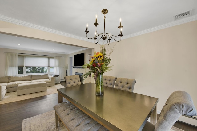 3309 Balsam St, Oceanside, NY 11572 - dining room with a chandelier, crown molding, wood finished floors, and baseboard heating