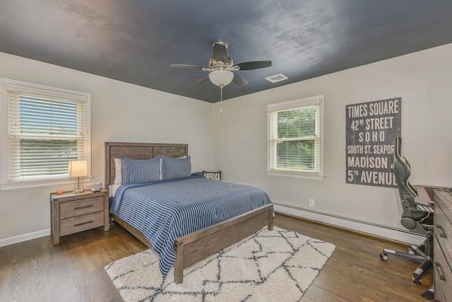 3309 Balsam St, Oceanside, NY 11572 - bedroom featuring baseboard heating, wood finished floors, and a ceiling fan