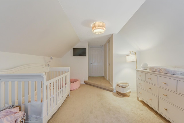 3309 Balsam St, Oceanside, NY 11572 - bedroom with light colored carpet, lofted ceiling, and a crib