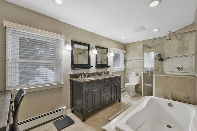 3309 Balsam St, Oceanside, NY 11572 - bathroom featuring baseboard heating, a bath, double vanity, a shower stall, and recessed lighting