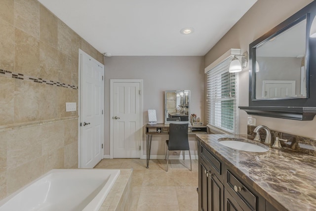3309 Balsam St, Oceanside, NY 11572 - bathroom featuring a garden tub, vanity, recessed lighting, and tile patterned flooring