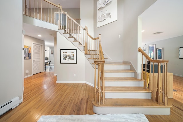 70 Hickory St, Blauvelt, NY 10913 - staircase featuring a baseboard radiator and wood finished floors