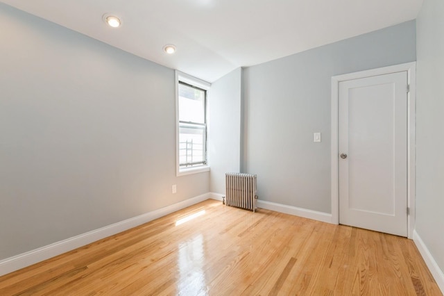 1110 Caton Ave Unit 5C, Brooklyn, NY 11218 - empty room featuring radiator, light wood-style flooring, and recessed lighting