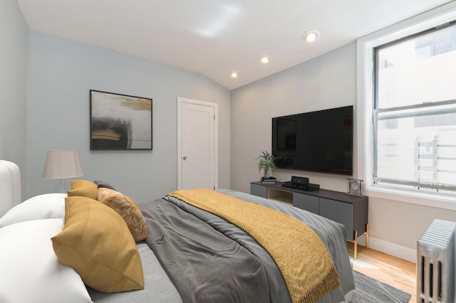 1110 Caton Ave Unit 5C, Brooklyn, NY 11218 - bedroom featuring radiator, wood finished floors, recessed lighting, and vaulted ceiling