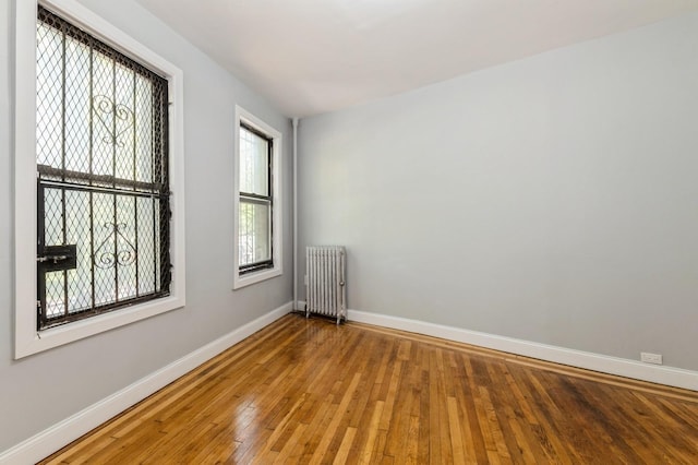 1110 Caton Ave Unit 5C, Brooklyn, NY 11218 - empty room with radiator heating unit and wood-type flooring
