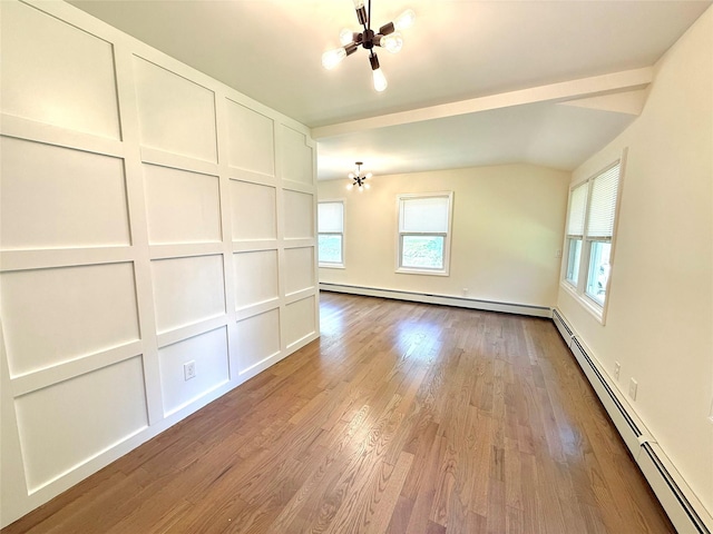 55 Red Mill Rd, Cortlandt Manor, NY 10567 - spare room featuring a chandelier, a baseboard heating unit, healthy amount of natural light, wood finished floors, and lofted ceiling
