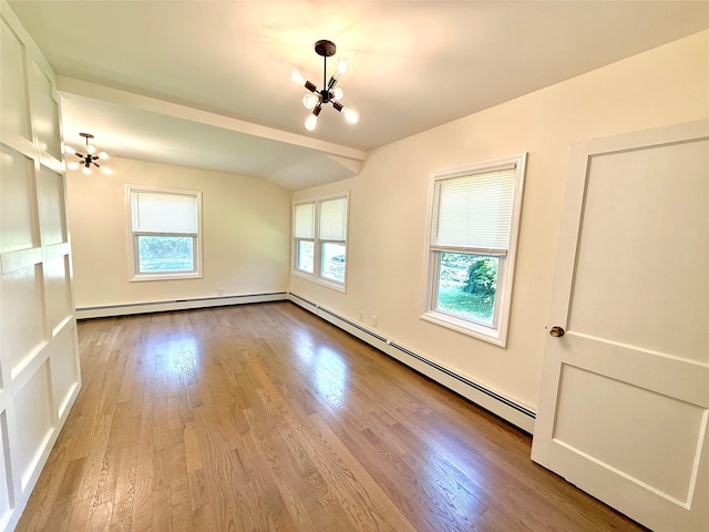 55 Red Mill Rd, Cortlandt Manor, NY 10567 - empty room featuring a chandelier, a baseboard heating unit, and wood finished floors