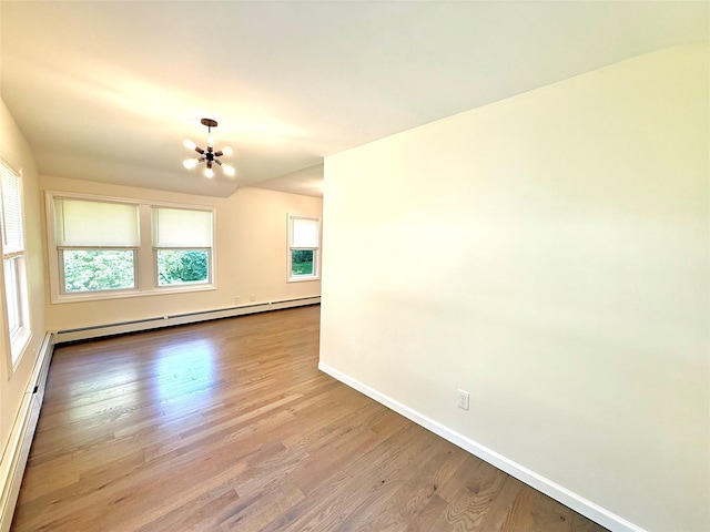55 Red Mill Rd, Cortlandt Manor, NY 10567 - empty room with a chandelier, a baseboard heating unit, and wood finished floors