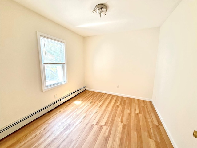 55 Red Mill Rd, Cortlandt Manor, NY 10567 - unfurnished room with a baseboard radiator and light wood-style floors