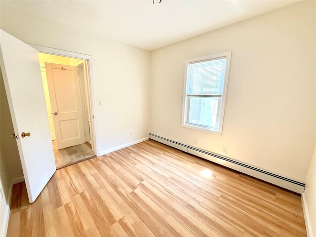 55 Red Mill Rd, Cortlandt Manor, NY 10567 - unfurnished room featuring a baseboard heating unit and light wood-type flooring