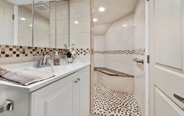 96-36 149th Ave, Ozone Park, NY 11417 - full bathroom featuring vanity, a walk in shower, tile walls, recessed lighting, and backsplash