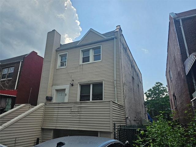 1053 Evergreen Ave, Bronx, NY 10472 - rear view of house featuring a chimney
