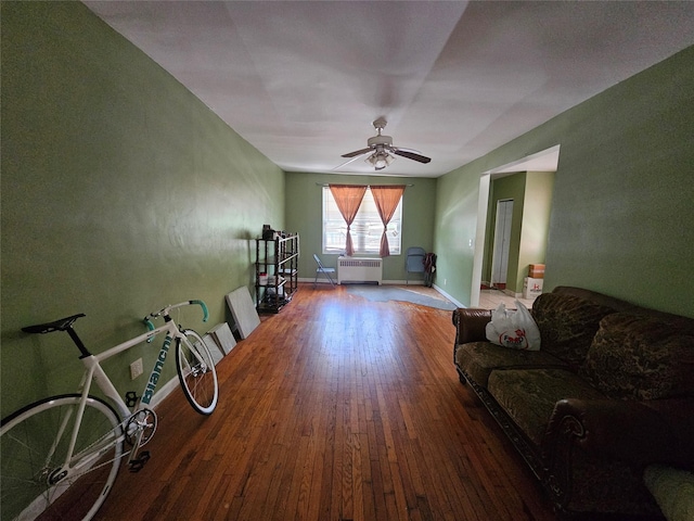 1053 Evergreen Ave, Bronx, NY 10472 - living room featuring radiator heating unit, hardwood / wood-style flooring, and ceiling fan
