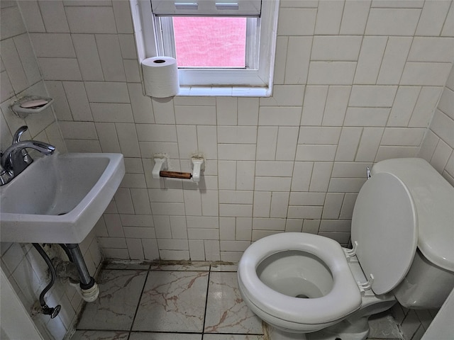 1053 Evergreen Ave, Bronx, NY 10472 - half bath with tile walls and marble finish flooring