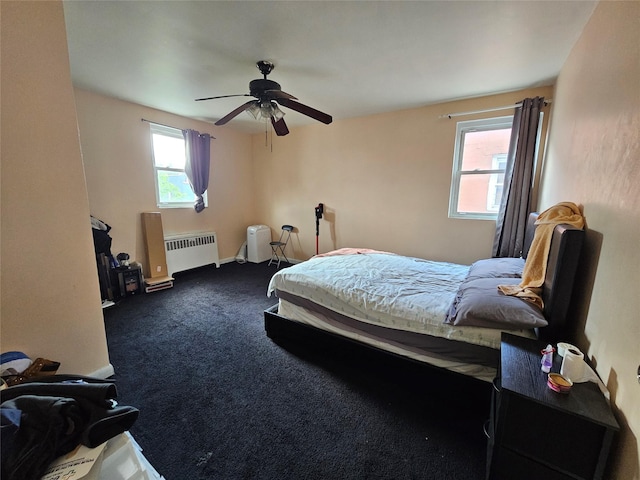 1053 Evergreen Ave, Bronx, NY 10472 - carpeted bedroom with radiator heating unit and ceiling fan