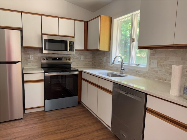5760 Rte 82, Clinton Corners, NY 12514 - kitchen with appliances with stainless steel finishes, light countertops, white cabinets, and backsplash