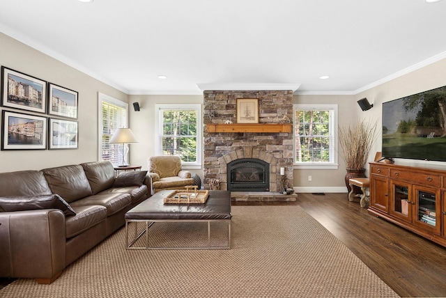 1 Alexis, Speonk, NY 11972 - living room with dark wood-style floors, ornamental molding, healthy amount of natural light, a stone fireplace, and recessed lighting