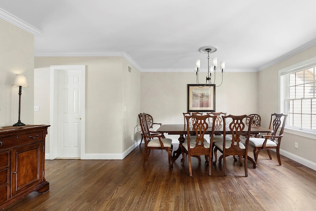 1 Alexis, Speonk, NY 11972 - dining space with dark wood-type flooring, a chandelier, and crown molding