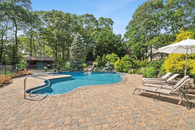 1 Alexis, Speonk, NY 11972 - outdoor pool featuring a patio area, view of wooded area, and an outbuilding
