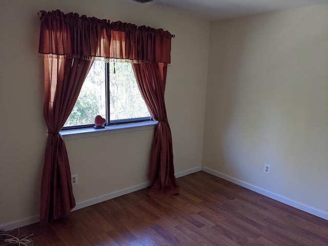 972 Skyline Dr Unit 972, Coram, NY 11727 - empty room featuring wood finished floors and baseboards