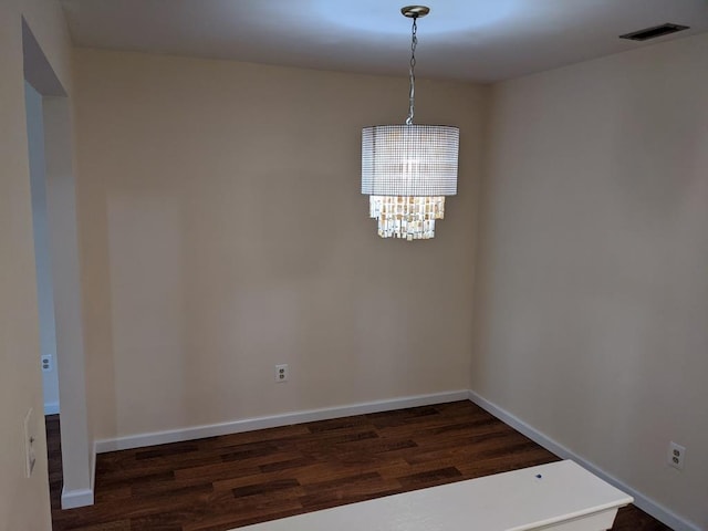 972 Skyline Dr Unit 972, Coram, NY 11727 - unfurnished room with dark wood-type flooring and a chandelier